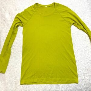 Lululemon long sleeve work out top. No stains. Great condition. Lemon lime color